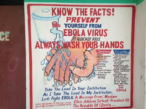 Liberian sign promoting hand-washing as a means to avoid spreading the Ebola virus. It also lists symptoms and precautions.