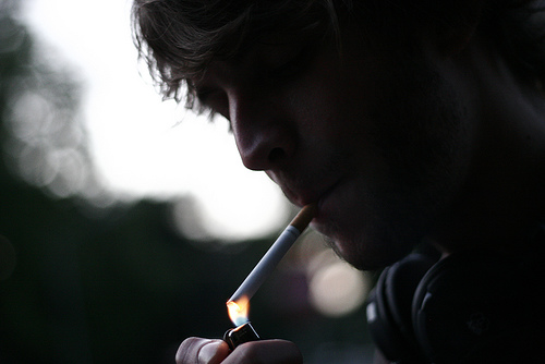 A man lights a cigarette. If local schools can dictate what science is taught, what's to stop a North Carolina school from teaching that cigarettes aren't unhealthy?