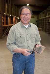 H. Paul Liu with a partial fossil of a eurypterid. Image from the Iowa Geological Survey website.