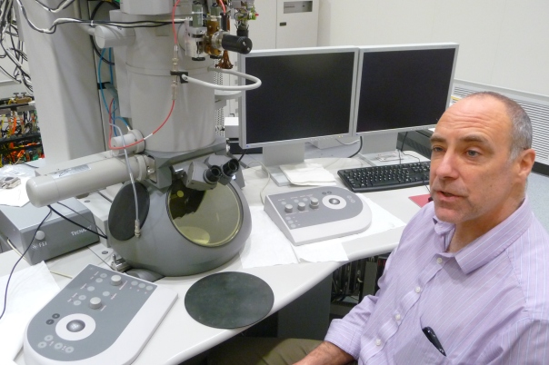 Ames Lab's Matt Kramer with the Tecnai transmission electron microscope at the new Sensitive Instrument Facility (SIF). The Tecnai TEM was moved to the SIF from Wilhelm Hall, one of the buildings the lab occupies on the Iowa State University campus.