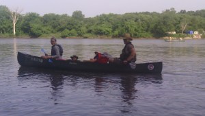 Laura Wolf, Al Mast and their young charges in a canoe on the Des Moines River during Project AWARE, July 13, 2016.