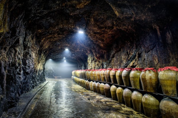 A former military tunnel in Taiwan, now converted to a cave to age rice wine in clay jars.